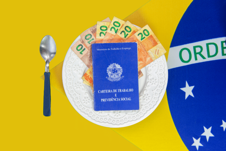 Foto sobre a Lei 14.442 com bandeira do Brasil, prato, carteira de trabalho e dinheiro.